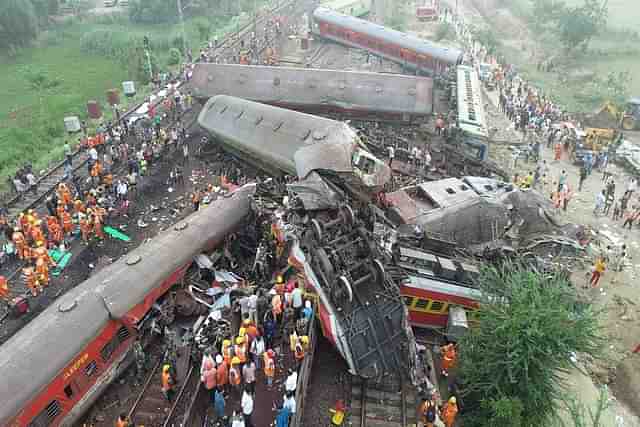 Locals, security personnel and NDRF at the ongoing rescue operations at the site.