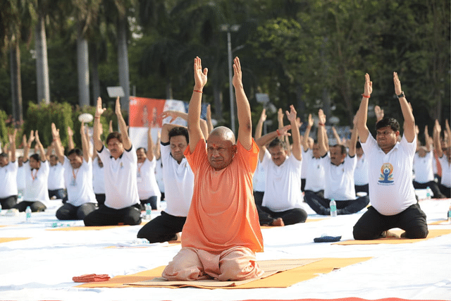 UP CM Yogi Adityanath performing yoga on the occasion of International Yoga Day at Rajbhawan in Lucknow, 2022 (Photo: Deepak Gupta/Hindustan Times)