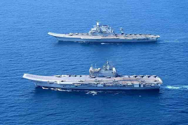 INS Vikramaditya and INS Vikrant, India's aircraft carriers, operating together at sea. 