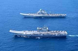 INS Vikramaditya and INS Vikrant, India's aircraft carriers, operating together at sea. 