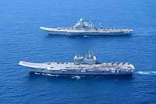 INS Vikramaditya and INS Vikrant, India's aircraft carriers, operating together at sea. 