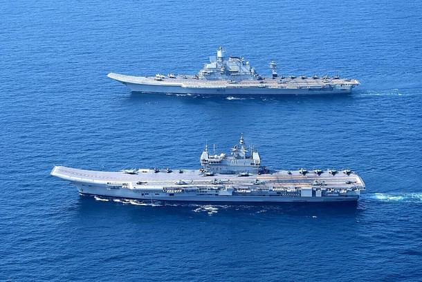 INS Vikramaditya and INS Vikrant, India's aircraft carriers, operating together at sea.