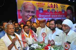 Santosh Kumar Suman (2nd from left) with his father Jitan Ram Manjhi (extreme left) at a party convention