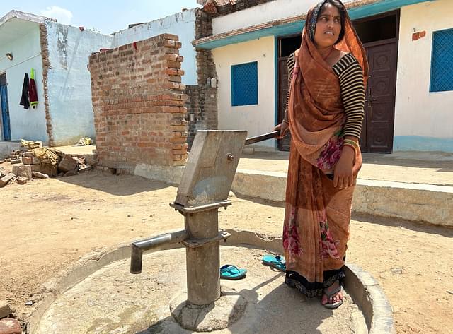 Kranti Devi of Bilwai village shows handpump that gives brine water