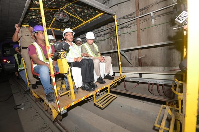 Union Minister Ashwini Vaishnaw and other officials during the trolley inspection.