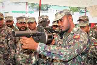 Maldivian National Defence Force soldiers inspecting the grenade launcher during Exercise Ekuverin with Indian Army at Uttarakhand's Chaubatia (via PIB)