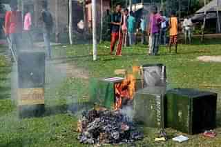 Ballot boxes allegedly snatched by Trinamool cadre from a polling booth at Malda being burnt during the 2018 panchayat polls.