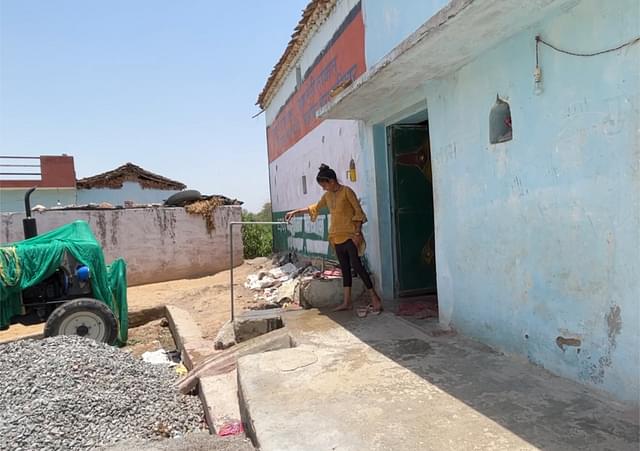 A resident of Shivhar closes the running tap at 12 pm when water supply begins daily