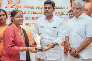 Uma Gargi receiving an award from BJP state president K Annamalai