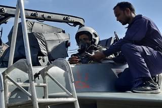 IAF Deputy Chief Ashutosh Dixit strapping in the seat of Tejas Mk-1A series production trainer aircraft. (Pic via Twitter @livefist)