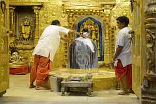 Hindu priests perform religious rituals at the Somnath temple.
