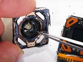 Closeup of the sensor inside the camera of the iPhone 12 Pro Max which moves within its house. Photo courtesy: Screengrab from YouTube video by JerryRigEverything