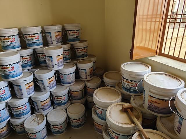 Paint boxes that are filled and ready for distribution is in display.