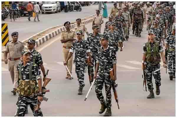Central forces marching under the supervision of state police personnel