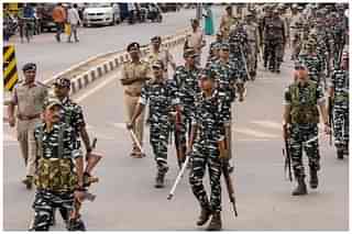 Central forces marching under the supervision of state police personnel