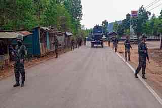 Army soldiers patrolling an area in the outskirts of Imphal.