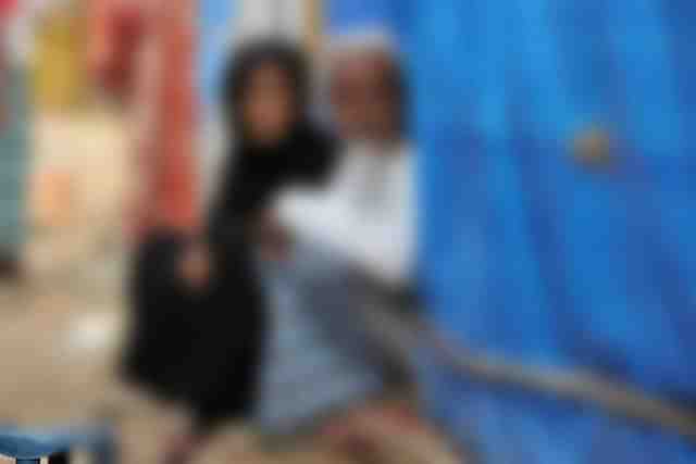 A Muslim man and his wife sit outside their tent. (Representative image). 