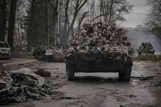 Ukrainian troops on an Infantry fighting vehicle. (Picture via AP Photo/Vadim Ghirda)