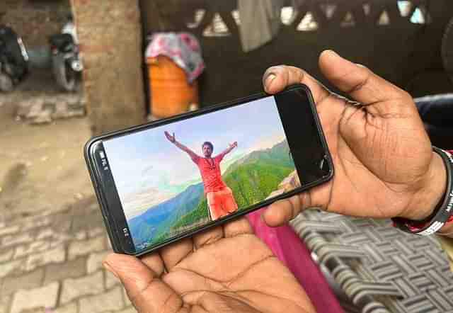 Sukhdev shows a picture of his kanwar yatra 