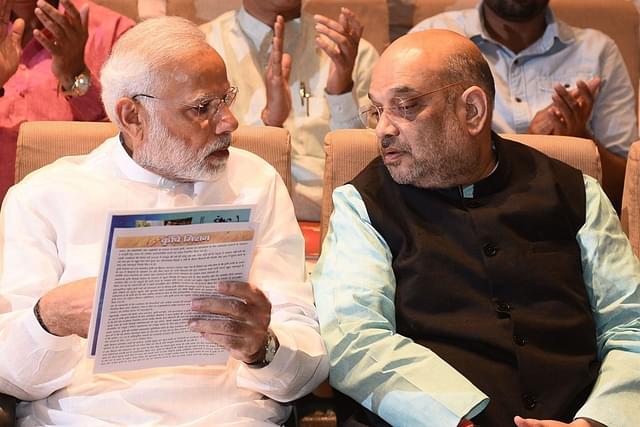 Prime Minister Narendra Modi with Union Home Minister Amit Shah. (Vipin Kumar/ Hindustan Times via Getty Images) 