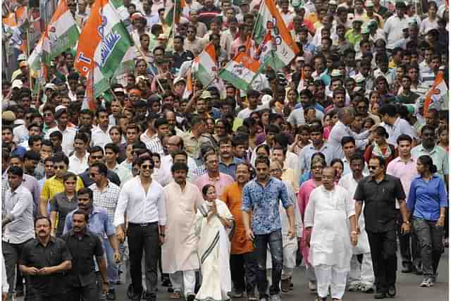 West Bengal CM Mamata Banerjee with TMC supporters in a rally (Photo by Subhankar Chakraborty/Hindustan Times via Getty Images)