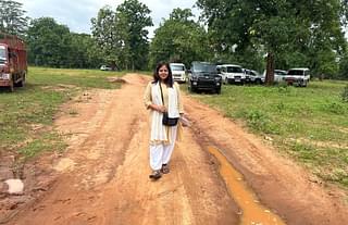 Swarajya correspondent Swati Goel Sharma near the boundary of the camp marked by parked vehicles. 