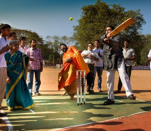 Second from left: Ajjamma watches on as former minister Pramod Madhwaraj attempts his hand at batting in a local cricket tournament in Udupi. 
(Picture courtesy: Astromohan)
