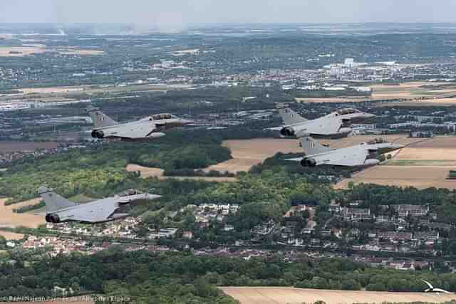 Three Indian Air Force's Rafale jets closely followed by the French Rafale jet. (Image via @IAF_MCC) 