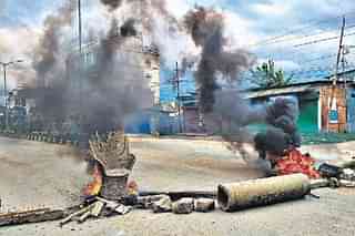 Meteis blocked roads in Imphal to protest Saturday's killings.