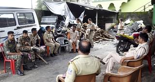 A police contingent guarding 'Chhota Pakistan' after angry residents of other areas ransacked the shanty of Mohammad Abbas