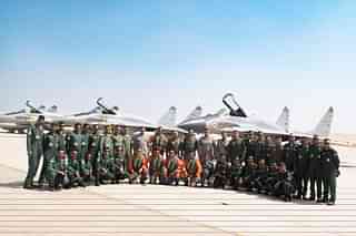 Indian Air Force contingent in Egpyt's Cairo airbase posing with three Mig-29 fighter jets in the background. (Pic via X @IAF_MCC)