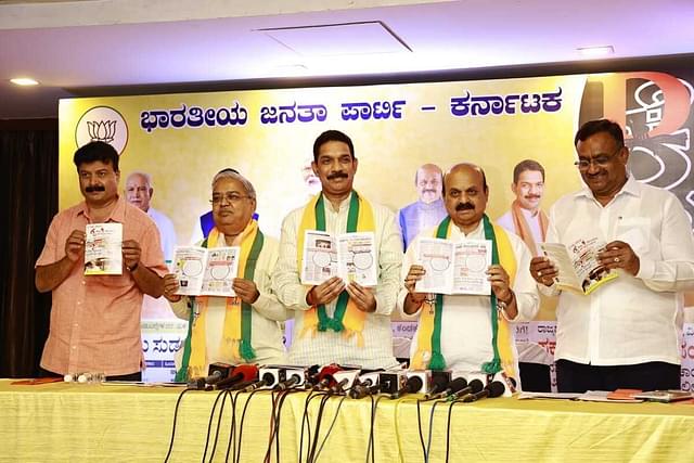 BJP leaders display their list of '100 days, 100 failures' of the Congress government in Karnataka.