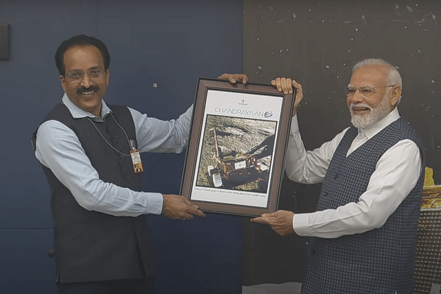 ISRO Chairman S Somanath and Prime Minister Narendra Modi during the latter's visit to the mission control in Bengaluru