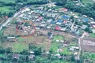 Aerial view of Torbung Bangla with the proposed mass burial site circled in red.
