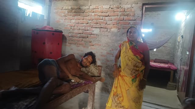 Dulari Devi with her son, who is ill