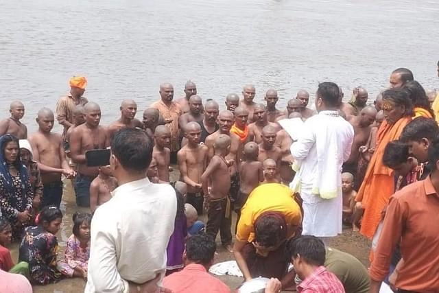 Muslim families taking holy dip in Narmada river to convert back to Hinduism