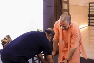 Rajinikanth touching the feet of UP CM Yogi Adityanath