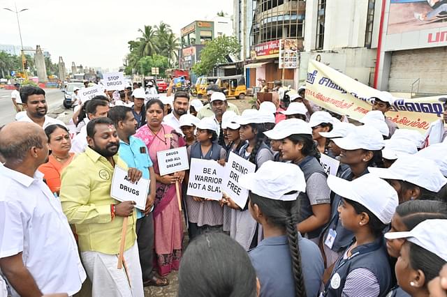 Suryah interacting with students.