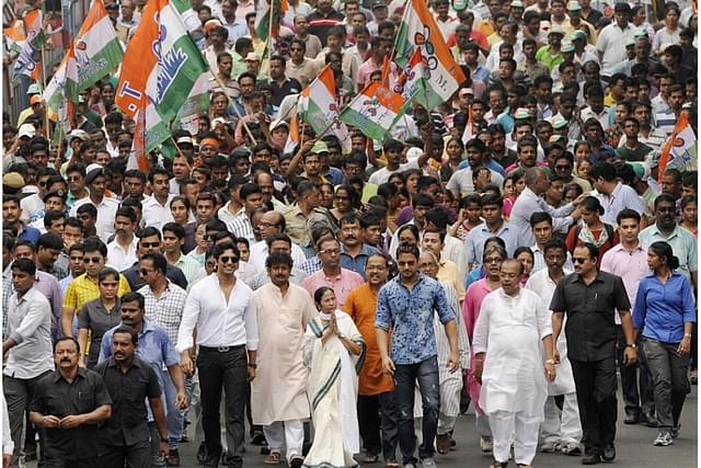 West Bengal Chief Minister Mamata Banerjee with TMC supporters in a rally. (Photo by Subhankar Chakraborty/Hindustan Times via Getty Images)