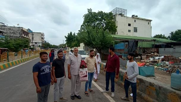Matlub Ahmed with other members of his family near their junk shop