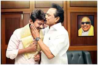 Udhayanidhi Stalin and M K Stalin in front of Karunanidhi's portrait. (Facebook)