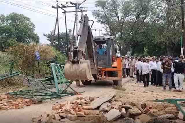 Bulldozer Carrying Out Demolition Drive
