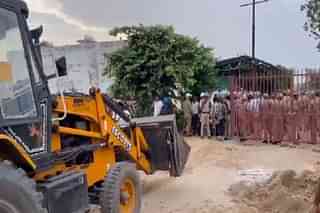 Bulldozer Carrying Out Demolition Drive