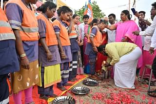 Suryah doing paada pooja of sanitation workers