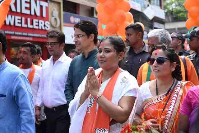 BJP's Tapasi Roy (in white saree) campaigning in Dhupguri.