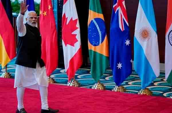 PM Narendra Modi waves as he arrives at Bharat Mandapam convention center for the G20 Summit 2023