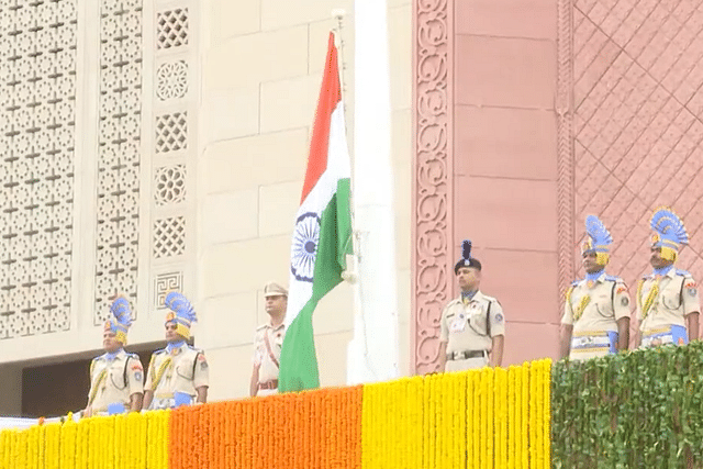 Vice President Jagdeep Dhankhar hoists national flag at the Gaja Dwar in the new Parliament building in Delhi.