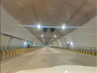 View of the tunnel in operation with exhaust systems and other equipments. 