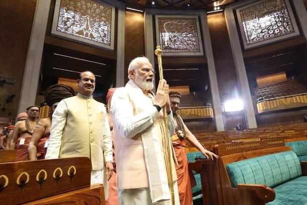 Prime Minister Narendra Modi with 'Sengol' in the Lok Sabha chamber.