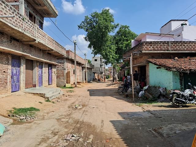 The condition of the road outside Krishna's shop